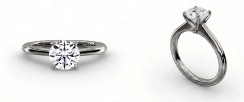A solitaire engagement ring in palladium, face up and from the side