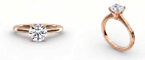 A solitaire engagement ring in rose gold, face up and from the side