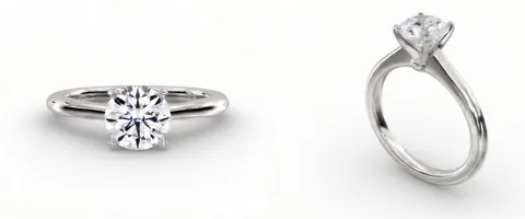 A solitaire engagement ring in white gold, face up and from the side