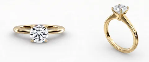 A solitaire engagement ring in yellow gold, face up and from the side