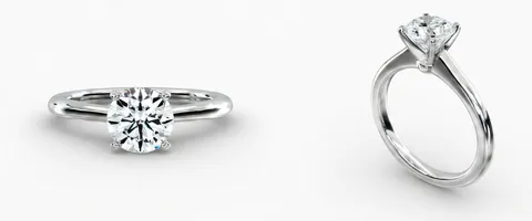 A solitaire engagement ring, face up and in profile
