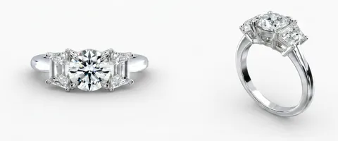 A three-stone engagement ring, face up and in profile
