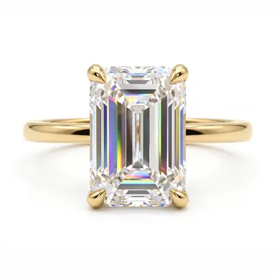 An emerald cut diamond in an engagement ring